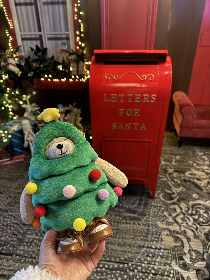 The real Fred Bear plush in front of a Letters for Santa mailbox